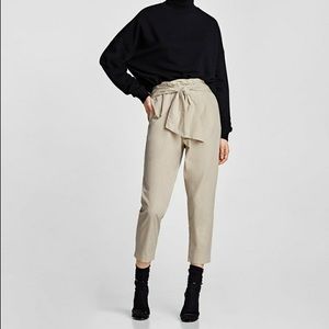 Trousers with bow belt